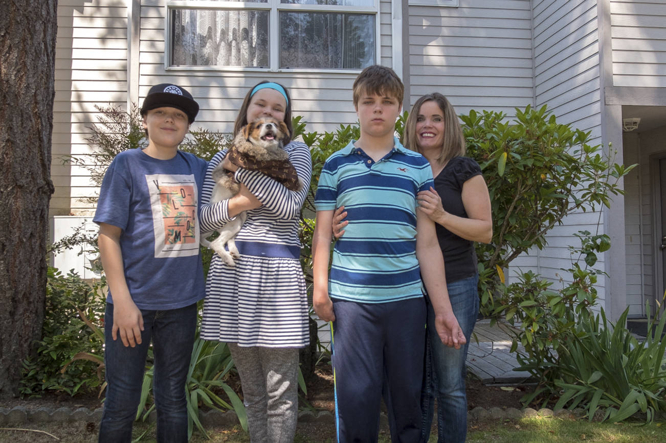 Ashton, 13, Chloe, 11, Cameron, 15, and their mother Joanne Wilson pose for a photo in front of their Habitat for Humanity townhome in Bellevue. Photo by Jose Perez.                                 Ashton, 13, Chloe, 11, Cameron, 15, and their mother Joanne Wilson pose for a photo in front of their Habitat for Humanity townhome in Bellevue. Photo by Jose Perez.                                 Ashton, 13, Chloe, 11, Cameron, 15, and their mother Joanne Wilson pose for a photo in front of their Habitat for Humanity townhome in Bellevue. Photo by Jose Perez.                                 Ashton, 13, Chloe, 11, Cameron, 15, and their mother Joanne Wilson pose for a photo in front of their Habitat for Humanity townhome in Bellevue. Photo by Jose Perez.