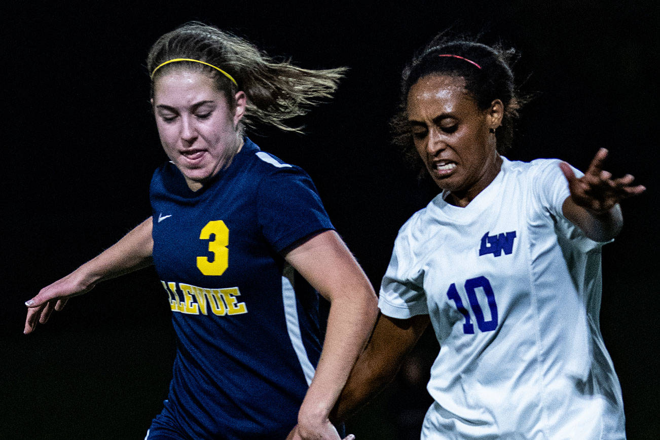 Bellevue Wolverines junior midfielder Courtney Serres, left, and Lake Washington player Haimanot Hanson, right, battle for possession of the ball in a loser-out 3A KingCo playoff game. Lake Washington defeated Bellevue 2-0 on Nov. 1 at Bellevue High School. The Wolverines finished the 2018 season with an overall record of 6-9-2. Photo courtesy of Stephanie Ault Justus
