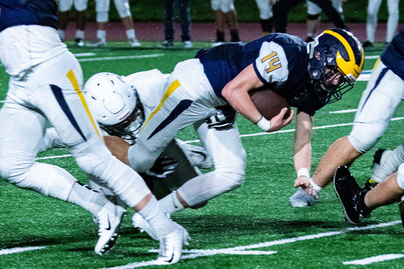 The Bellevue Wolverines football team improved their overall record to 10-0 courtesy of a 34-7 victory against Shorecrest in a winner-to-state, loser-out playoff game on Nov. 3 at Bellevue Memorial Stadium. Bellevue junior running back Alex Reid (pictured) battled for extra yardage against the Shorecrest defense. The Wolverines will host Snohomish in the first round of the Class 3A state playoffs at 7 p.m. on Nov. 9 at Bellevue Memorial Stadium. Photo courtesy of Stephanie Ault Justus