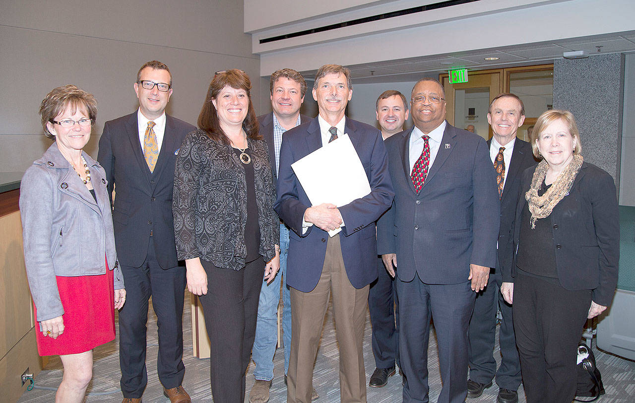 Members of the King County Council join retiring executive director of ARCH Arthur Sullivan after the council recognized Sullivan as a voice for affordable housing in East King County. Photo courtesy of King County.