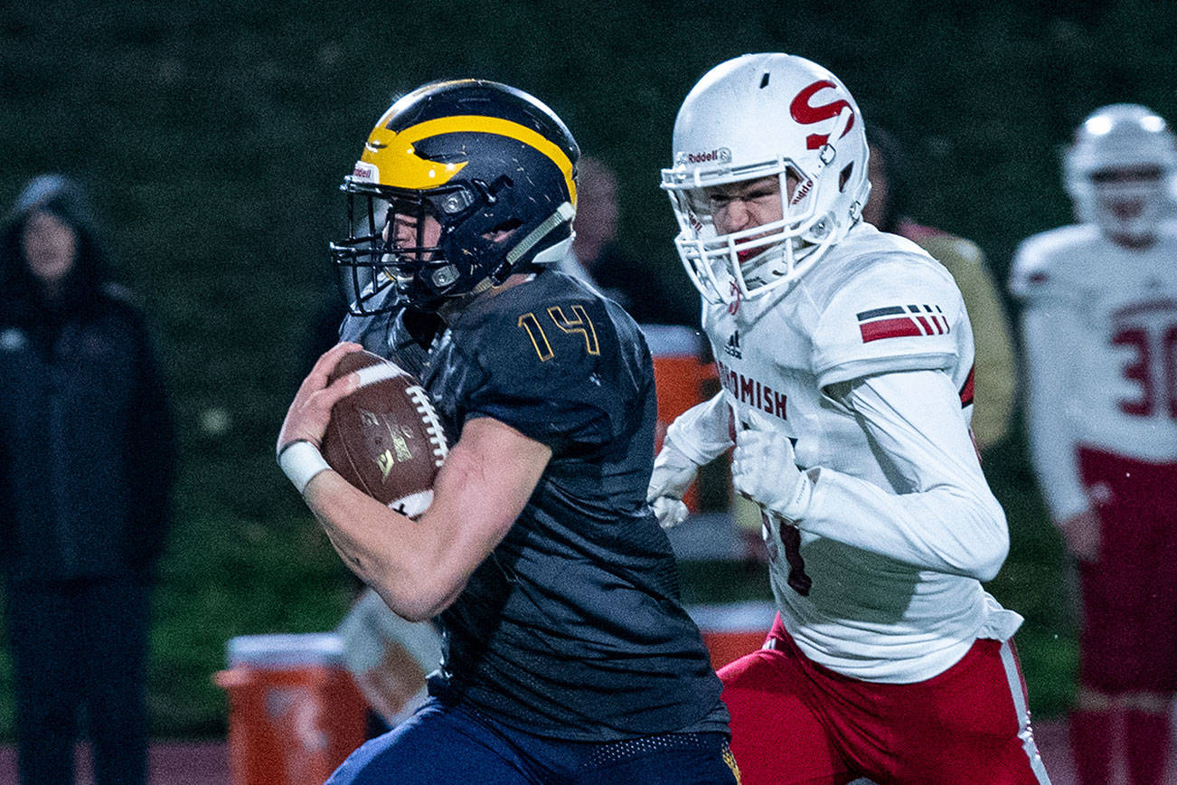 Bellevue Wolverines junior running back Alex Reid breaks free for a long gain against the Snohomish Panthers. Reid had two rushing touchdowns in Bellevue’s 66-33 victory against the Panthers on Nov. 9 at Bellevue Memorial Stadium. Photo courtesy of Stephanie Ault Justus