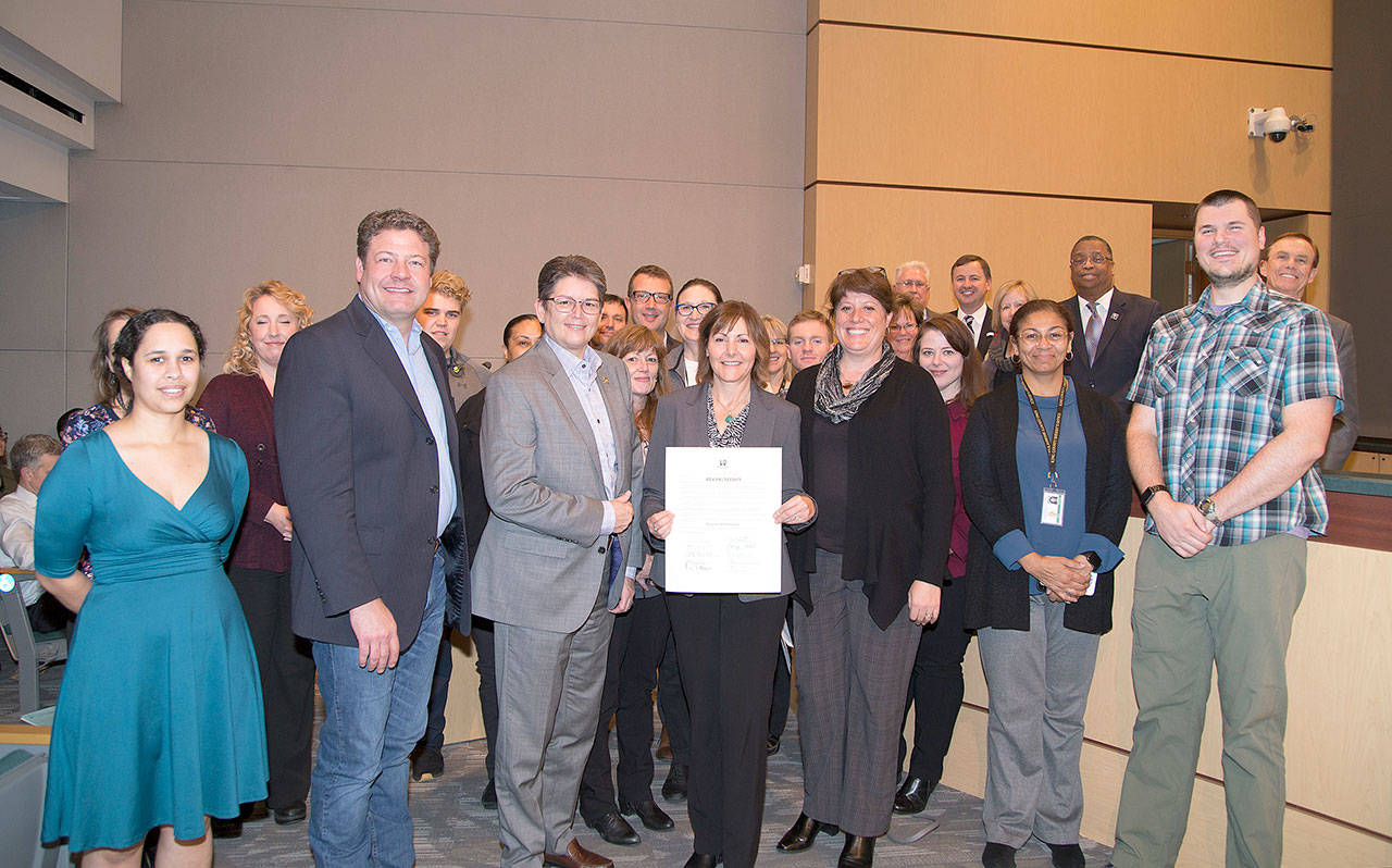 The Council recognized the AFIS program as it celebrates 30 years of assisting law enforcement throughout King County. Councilmembers, AFIS staff and King County Sheriff Mitzi Johanknecht join AFIS regional manager, Carol Gillespie. Photo courtesy of King County.