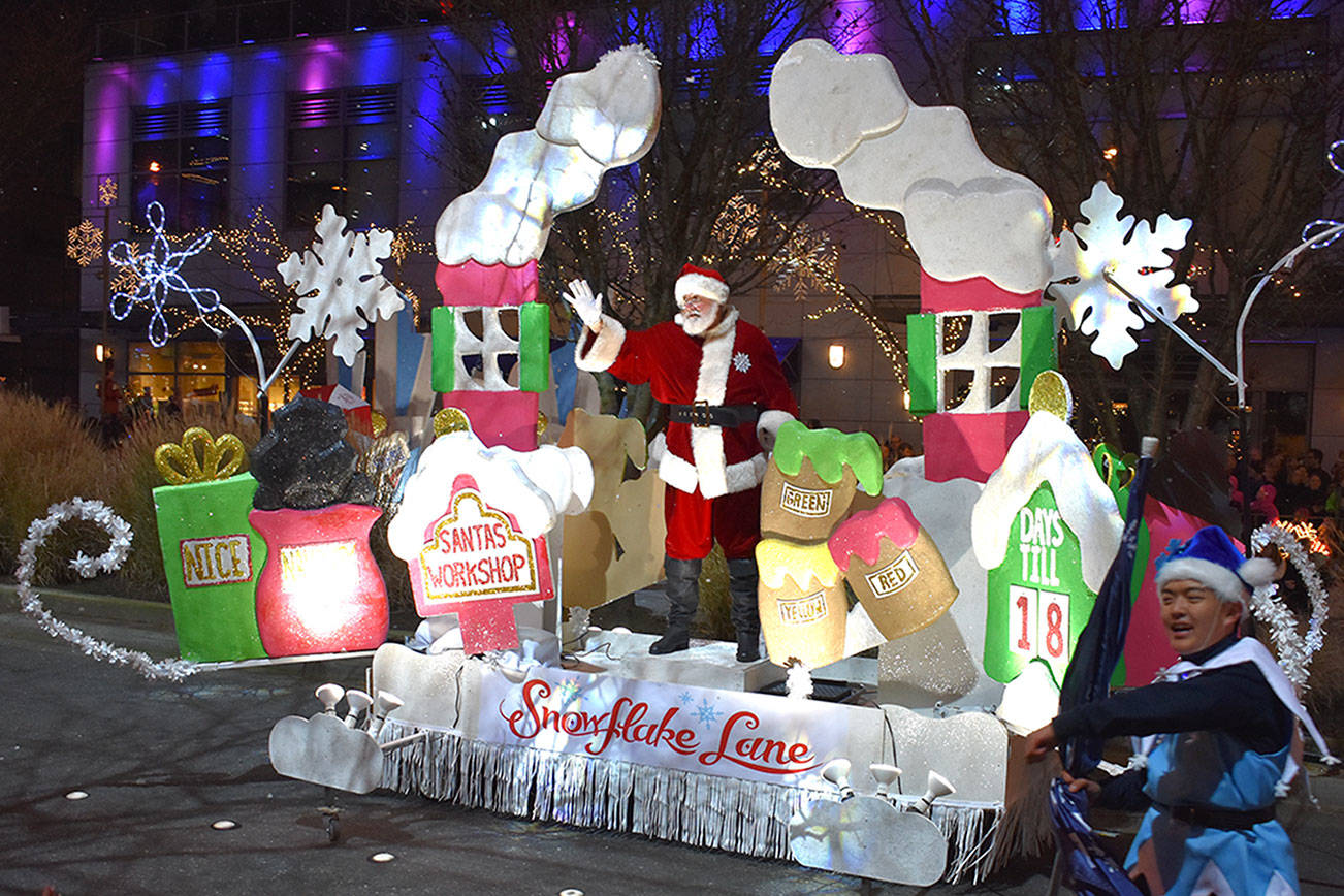 Snowflake Lane attendees can take photos with characters. Thousands of people visit Bellevue Way each winter to watch the live performance at 7 p.m. through Dec. 24. Reporter file photos