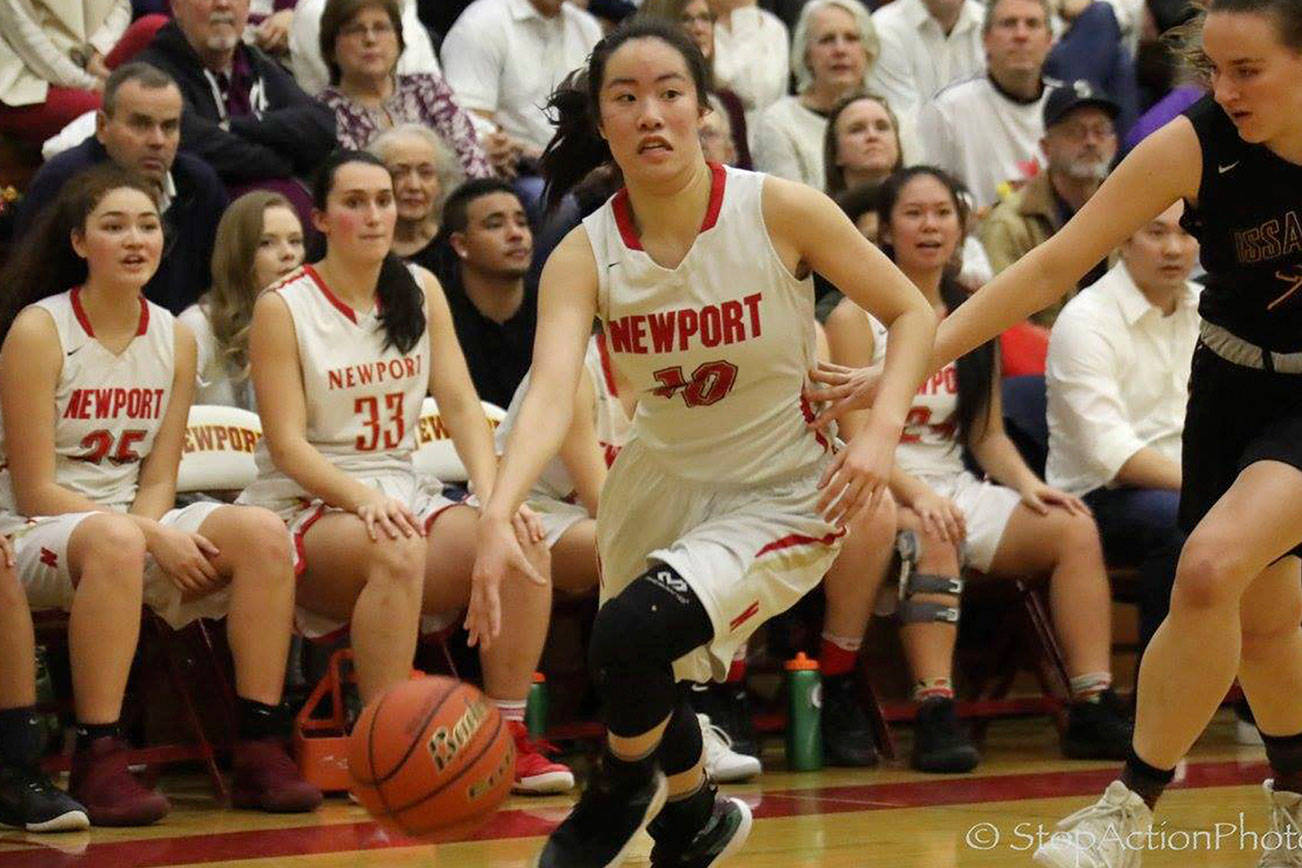 Newport Knights senior guard Nicole Chan drives to the hoop against the Issaquah Eagles in a game during the 2017-18 season. Chan, who is one of six seniors on the varsity roster during the 2018-19 season, wants to see her squad advance to the Class 4A state tournament at the Tacoma Dome in March of 2019. Photo courtesy of Don Borin/Stop Action Photography