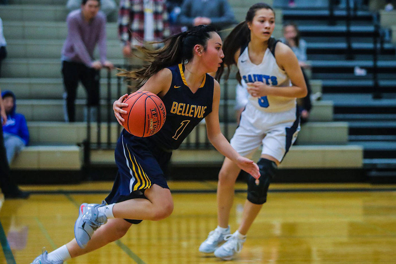 The Bellevue Wolverines registered a 52-47 win against the Interlake Saints on Dec. 7 at Interlake High School in Bellevue. The Wolverines improved their overall record to 2-2 with the win while Interlake dropped to 0-5. Bellevue junior guard Kara Choi (pictured) takes the ball to the hoop against the Interlake Saints. Photo courtesy of Don Borin/Stop Action Photography