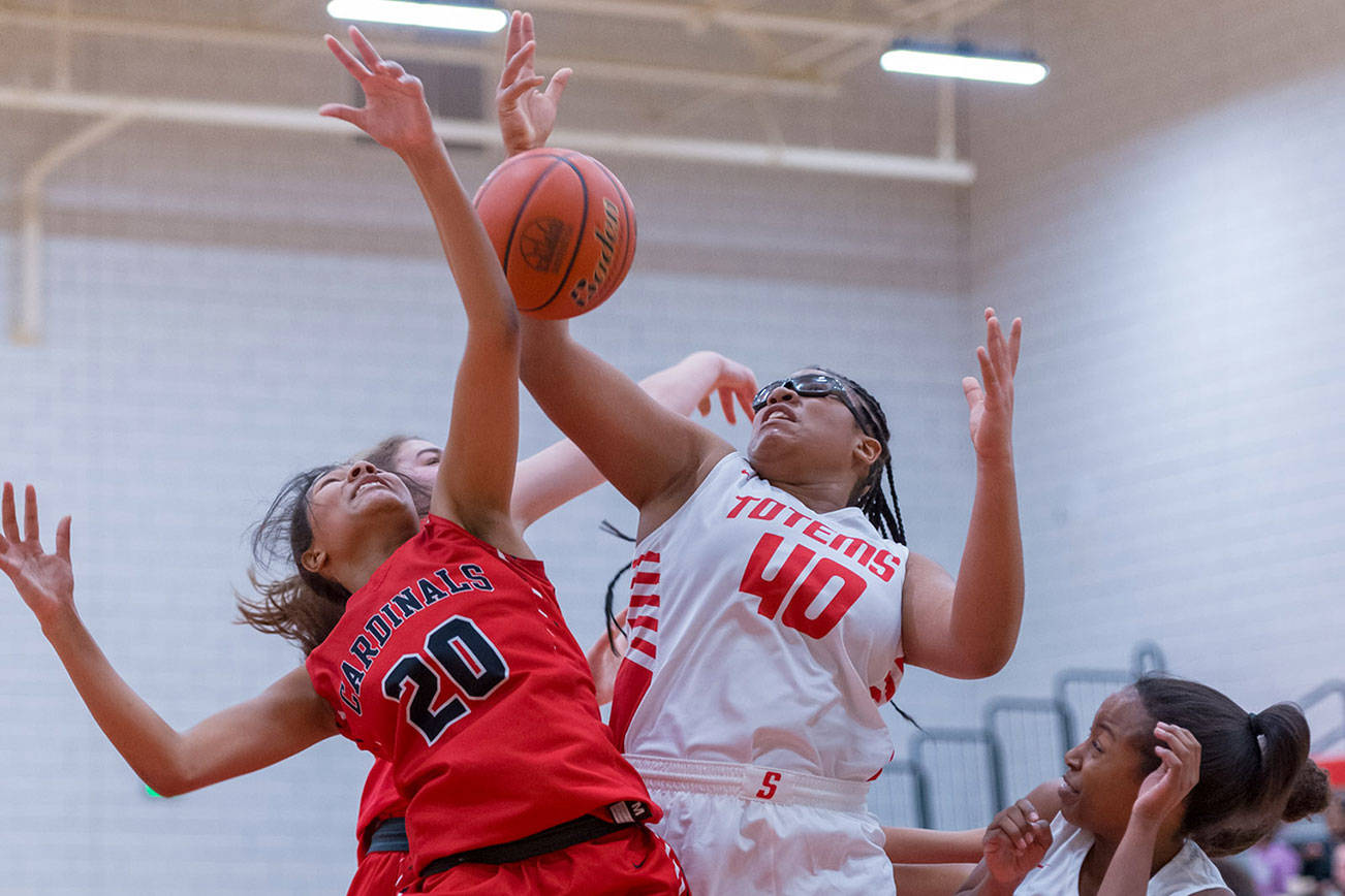 Sammamish Totems sophomore Tia Robinson (No. 40) battles for a rebound against Franklin Pierce sophomore Paradise Dorrough, left, in a non-league matchup on Jan. 3 in Bellevue. Photo courtesy of Patrick Krohn/Patrick Krohn Photography