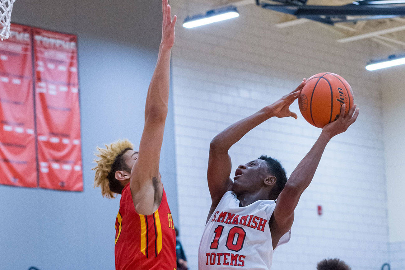 Sammamish Totems junior Adama Drammeh (No. 10) takes the ball to the hoop against the Franklin Pierce Cardinals in a non-league contest on Jan. 3 in Bellevue. Drammeh finished with a total of nine points in the loss. Photo courtesy of Patrick Krohn/Patrick Krohn Photography