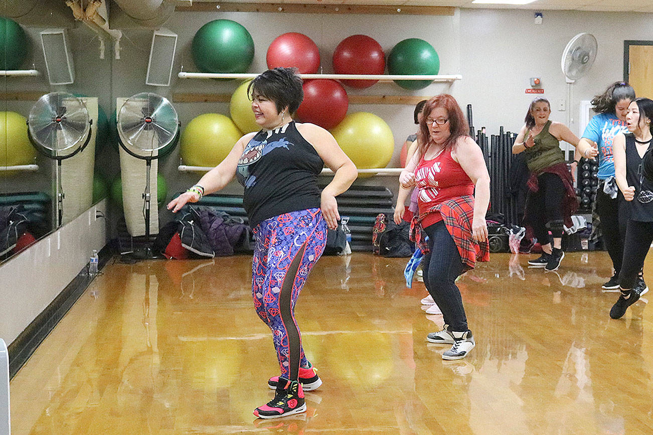 Zumba instructor Cristina Herrera led the Zumbathon event on Jan. 5 at the YMCA in Bellevue. The Zumbathon was hosted to collect blankets for the homeless. Stephanie Quiroz/staff photo