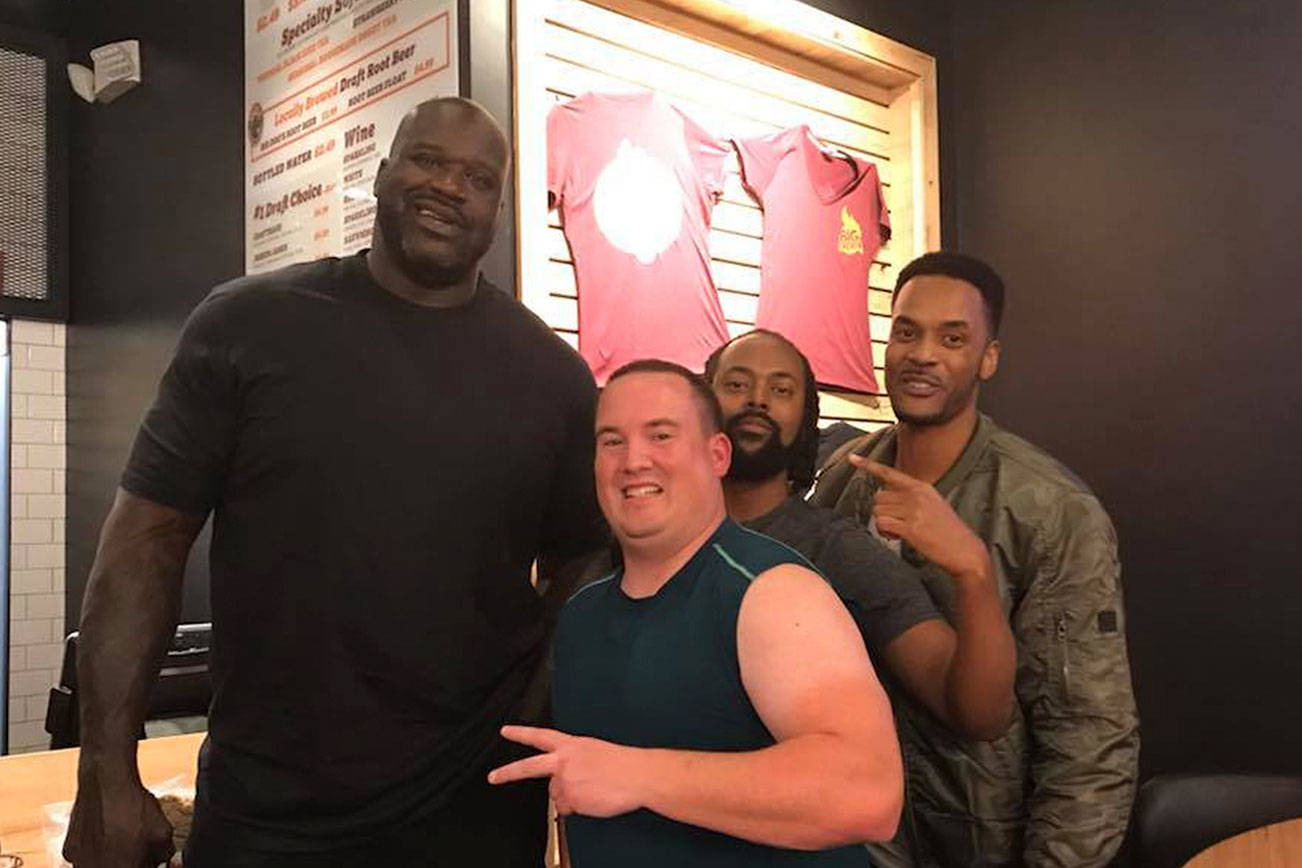 Sportswriter Shaun Scott and his friends Brian Walker and Tony Walker met NBA legend Shaquille O’Neal at Big Chicken restaurant in Las Vegas, Nevada on Nov. 24. Courtesy photo