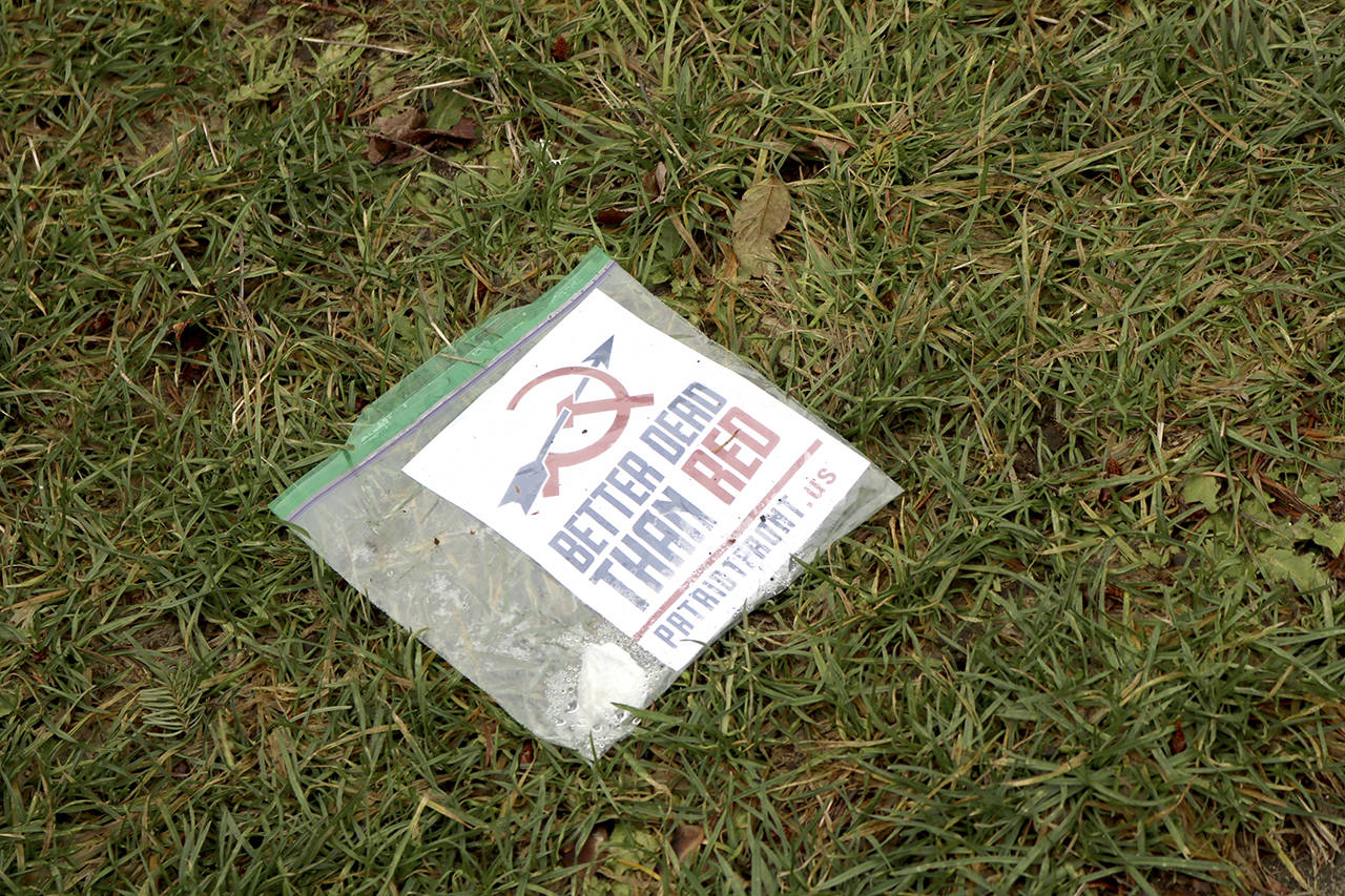 A flyer lays outside a Bellevue home on Tuesday. Ashley Hiruko/ staff photo
