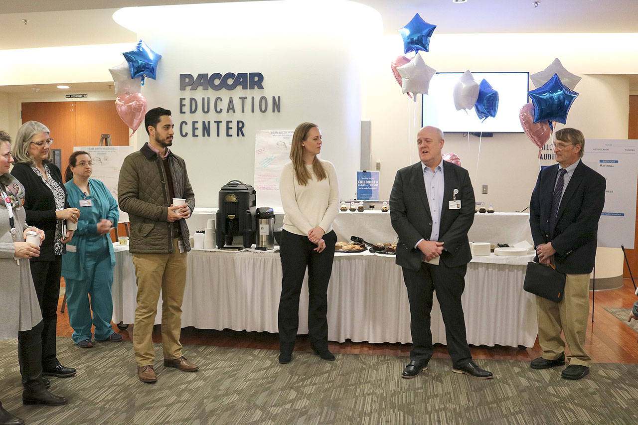 Overlake Medical Center president and CEO Mark Mike Marsh, along with Amber Weiseth and Dr. Bill Berry from Ariadne Labs in Boston speak of the importance of the Team Birth Project on Jan 22. Stephanie Quiroz/staff photo