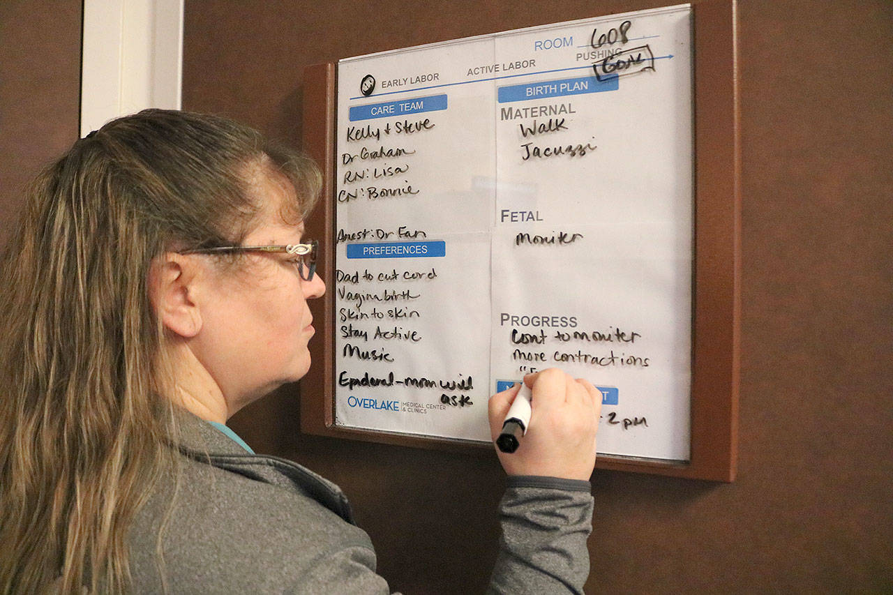 The patient-facing whiteboard allows accessible and transparent communication between the patient and her childbirth team. Stephanie Quiroz/staff photo.