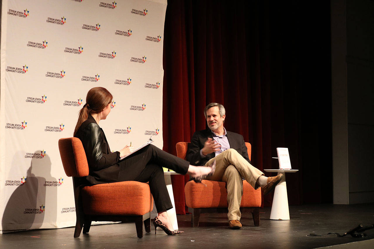 From left, KUOW’s “All Things Considered” host Kim Malcolm interviews New York Times journalist Jonathan Weisman about the rise of bigotry in the United States. Samantha Pak/staff photo