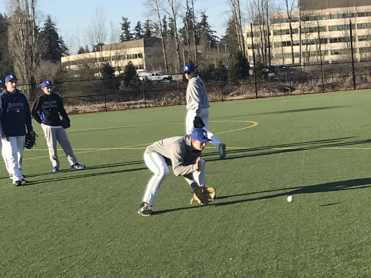 Bellevue Christian Vikings infielder Ben Douglass (pictured) fields a grounder during a practice session on March 6 at Marymoor Park. Shaun Scott, staff photo