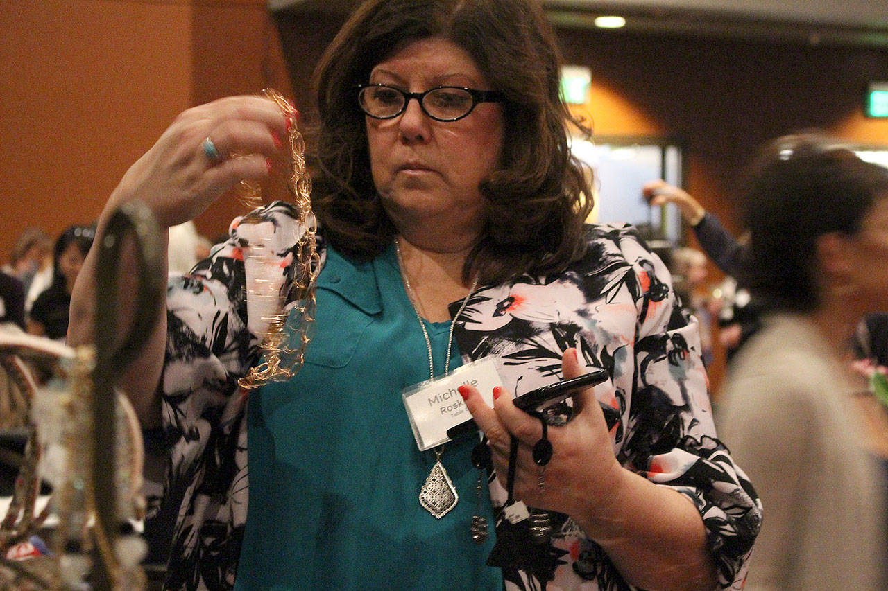 Michelle Roskilly shops at Thrift Culture at the annual Bellevue LifeSpring benefit luncheon. Madison Miller/staff photo