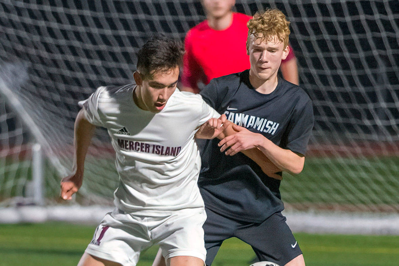 Mercer Island Islanders senior Dakota Promet, left, and Sammamish freshman Andrew Wilbert, right, battle for possession of the ball on March 26 at Sammamish High School. Mercer Island defeated Sammamish 1-0. Photo courtesy of Patrick Krohn/Patrick Krohn Photography