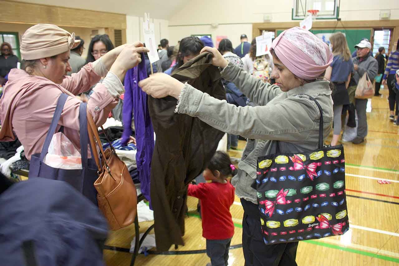 Guests picked out free clothing at the annual HopeFest on March 16. Stephanie Quiroz/staff photo.