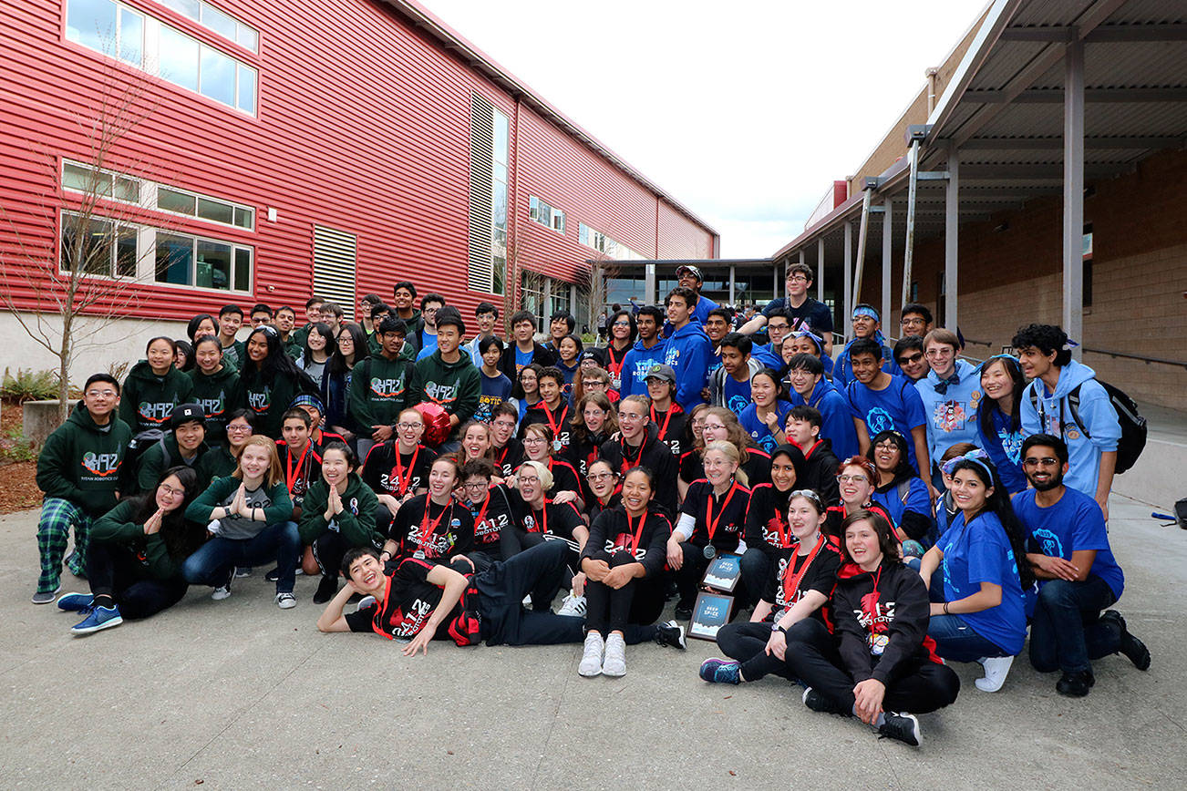 Courtesy photo                                Three Bellevue School District robotics teams after a competition in late March. From left: International School robotics team, Sammamish High School robotics team, and Interlake High School robotics team.