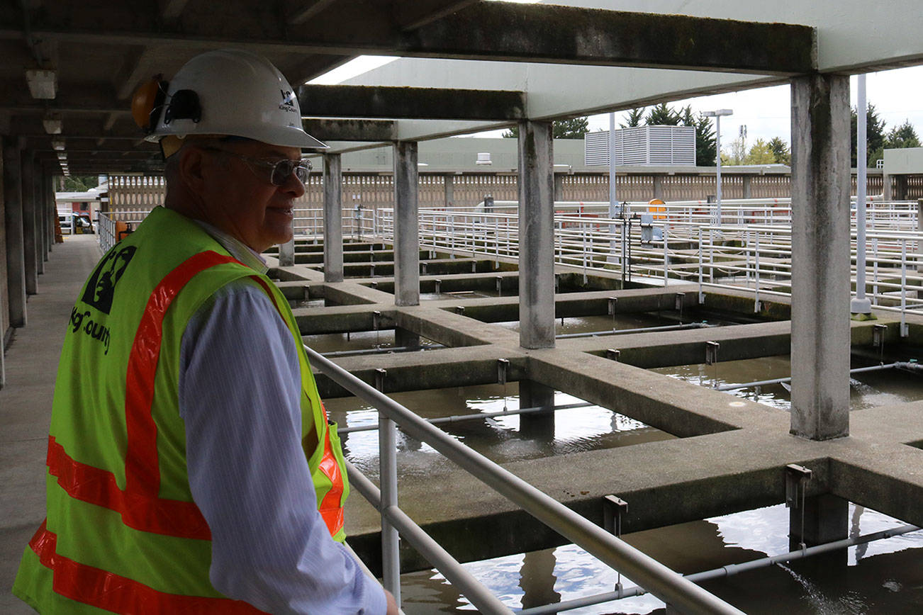 Jim Pitts stands on walkway overlooking filtration chambers at the King County South Filtration Plant in Renton. Aaron Kunkler/staff photo