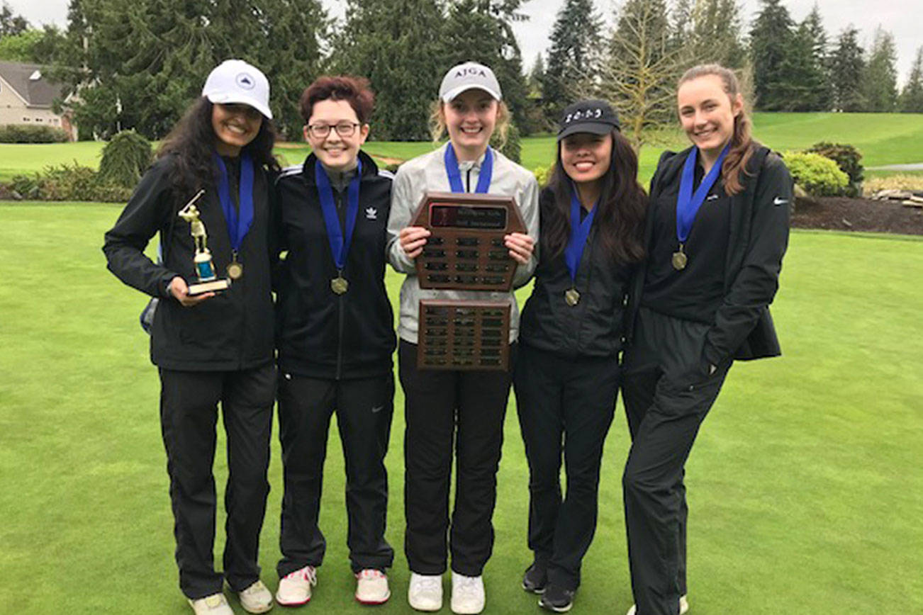 Sammamish Totems golfers Mehr Luthra, Mikaela Ikeda, McKenna Lamb, Lily Bai and Sierra Hopper celebrate after their team’s victory at the Burlington-Edison Invitational on April 22. Photo courtesy of Annette LaBissoniere