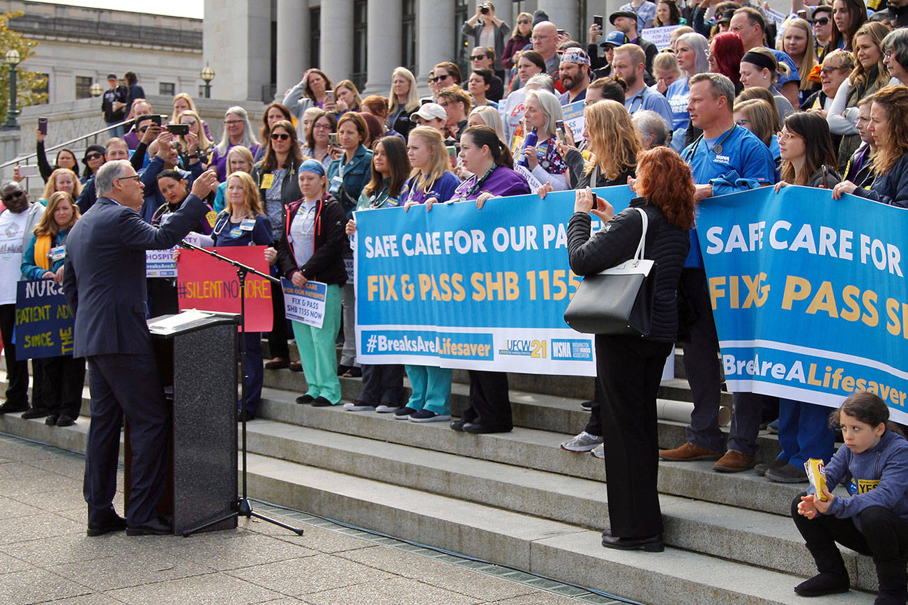 Gov. Jay Inslee speaks to protesting nurses on April 24 at the State Capitol Building in Olympia. Inslee indicated he would sign the bill for meal and rest breaks into law if it passes both chambers. Photo by Emma Epperly, WNPA Olympia News Bureau