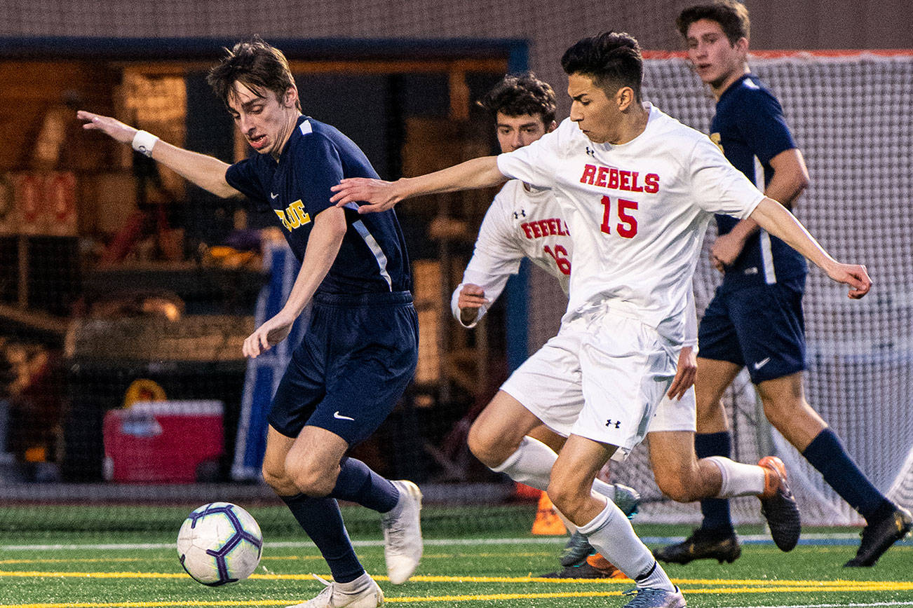 Bellevue Wolverines forward Jed Michael, left, scored two goals against the Juanita Rebels on April 25. Bellevue defeated Juanita 2-0 to improve its overall record to 10-0-3. Photo courtesy of Stephanie Ault Justus