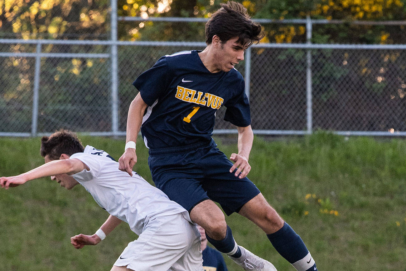 Bellevue player Alex Miller, right, battles for possession of the ball against Interlake’s Julio Canimo, left, in the 3A KingCo tournament title game on May 7 in Bellevue. Photo courtesy of Stephanie Ault Justus