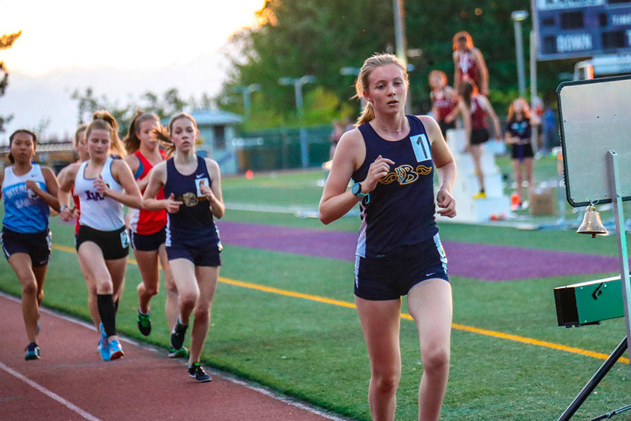 Bellevue Wolverines junior Katherine Forsberg, right, registered first-place finishes in the 1,600 and 3,200 at the 2019 KingCo 3A championship track meet. Photo courtesy of Don Borin/Stop Action Photography
