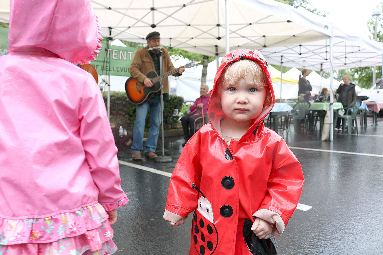 Avery Bridenbaugh, 2, from Issaquah danced to live music at Bellevue Farmers Market opening day on May 16. Stephanie Quiroz/staff photo