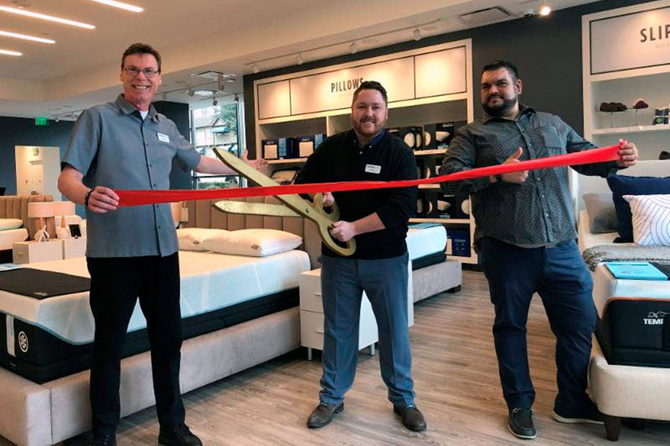 Bellevue Chamber of Commerce / courtesy photo                                (From left) store lead David Heimann, Bellevue store manager Brody Rodgers and store lead Kirby Fralick. celebrate at the Bellevue Tempur-Pedic flagship retail store ribbon cutting on March 7.