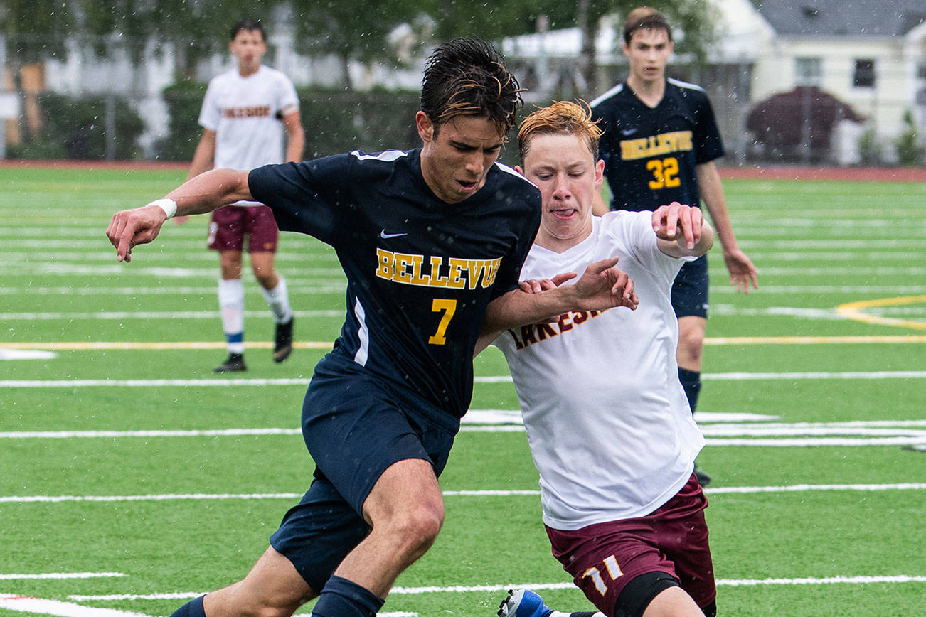 Bellevue Wolverines senior midfielder Alex Miller, left, and Lakeside senior defender Benjamin Brown, right, fight for a loose ball in the 3A state championship soccer game on May 25 at Sparks Stadium in Puyallup. Lakeside defeated Bellevue 2-0. Photo courtesy of Stephanie Ault Justus