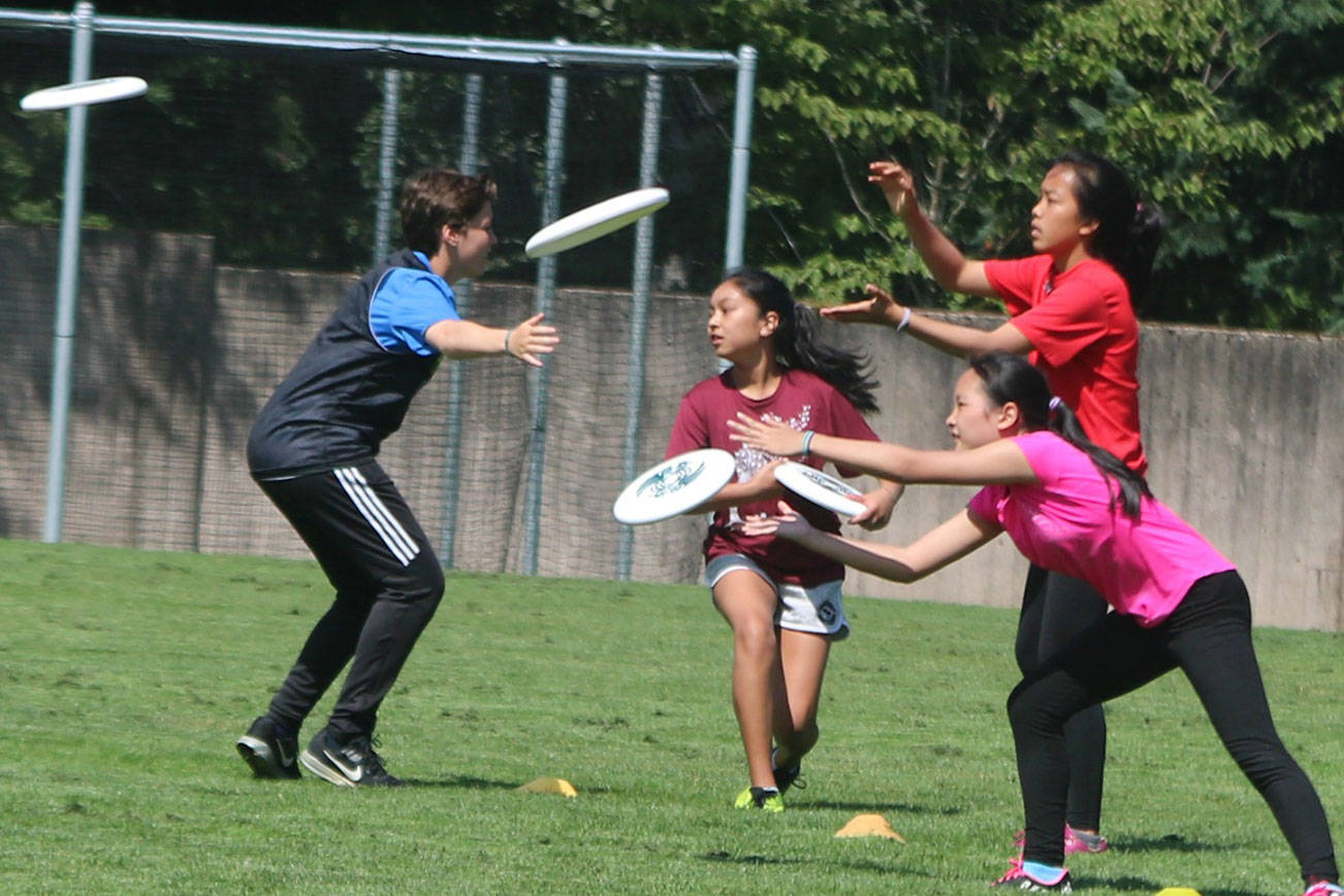 Following the flying disc at youth ultimate camp in Bellevue