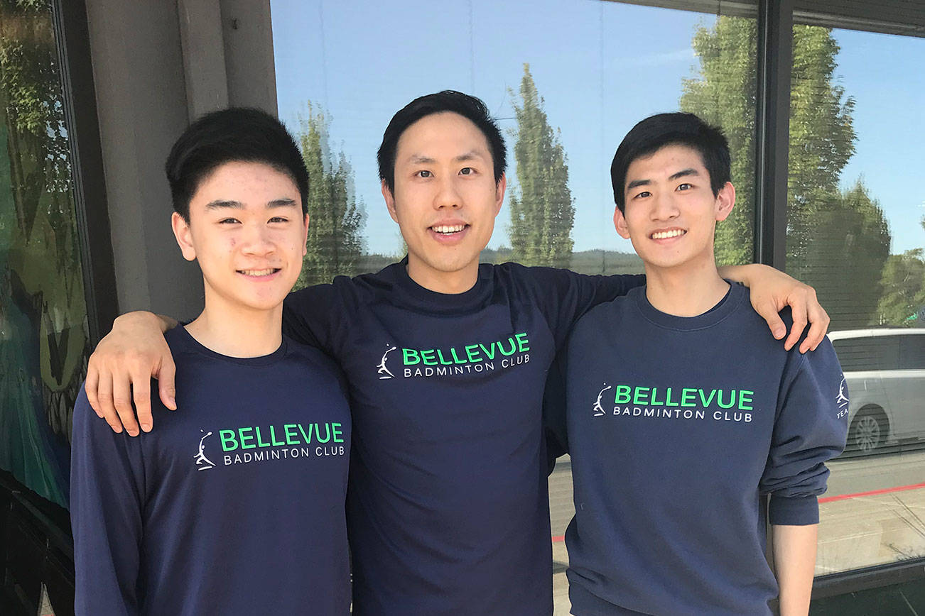 Bellevue Badminton club players Willam Hu, left, and Jacob Zhang, right, captured first place in their divisions at the 2019 Junior National Championships in Frisco, Texas. The players were coached by Derrick Ng, center. Shaun Scott/staff photo