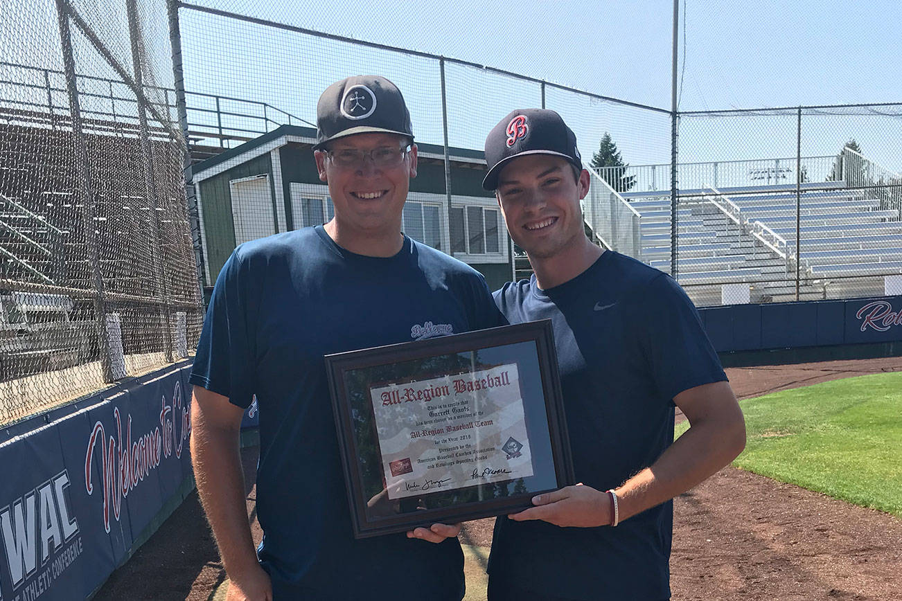 Bellevue Bulldogs associate head coach/hitting coach David Olson, left, poses for a quick picture with Bulldogs baseball player Garrett Gants on July 30. Gants was selected to the All-Region baseball team, which was voted on by the American Baseball Coaches Association. Shaun Scott/staff photo
