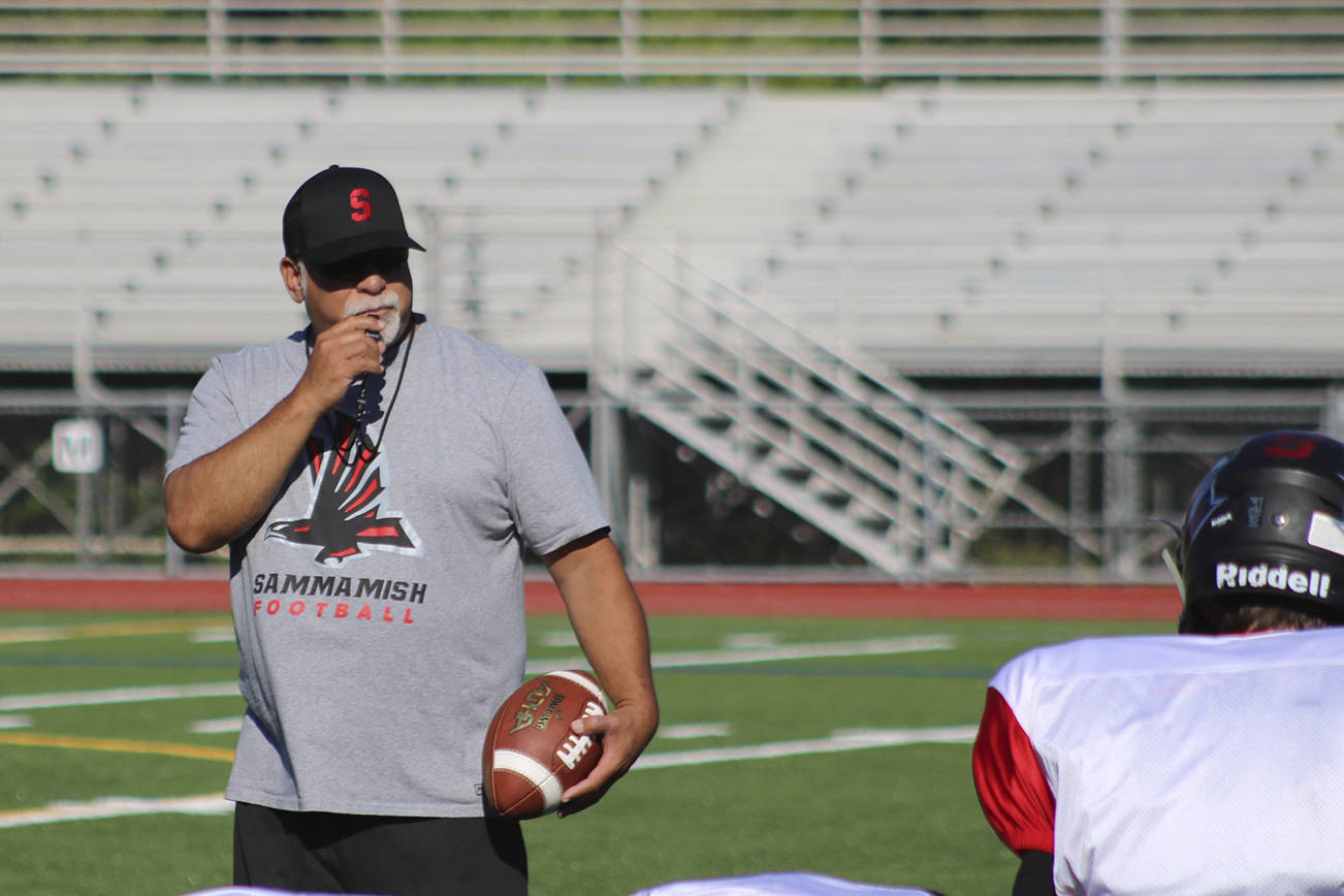 Head coach Rylen Akana blows his whistle while addressing his team during practice. Benjamin Olson/ staff photo