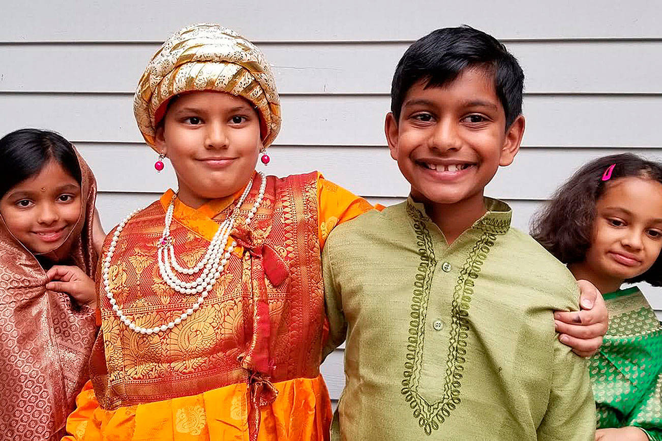 Photo courtesy of Yash Limaye                                From left, Reva Galande, Mihir Limaye, Amol Rane and Ahana Ranade prepare for the fancy dress competition part of Deepmala.