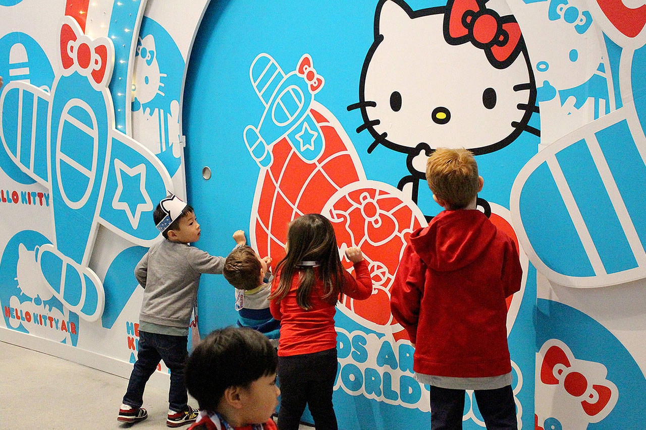 Children knock on the Hello Kitty tour to start the debut tour on Dec. 7. Madison Miller/staff photo