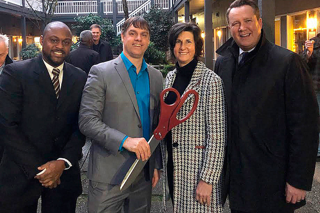 Bellevue councilmember Jeremy Barksdale, CFH executive director David Bowling, Mayor Lynne Robinson and Deputy Mayor Jared Nieuwenhuis celebrate the opening of CFH’s permanent year-round men’s shelter on Jan. 13. Courtesy photo