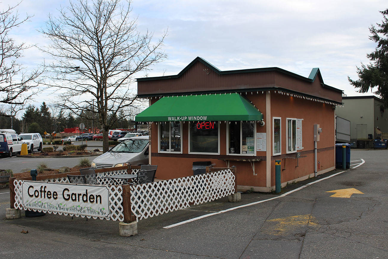 Mitchell Atencio/Staff Photo                                A customer orders a drink at the drive-thru of Megan’s Coffee Corner in Bellevue on Feb. 25.