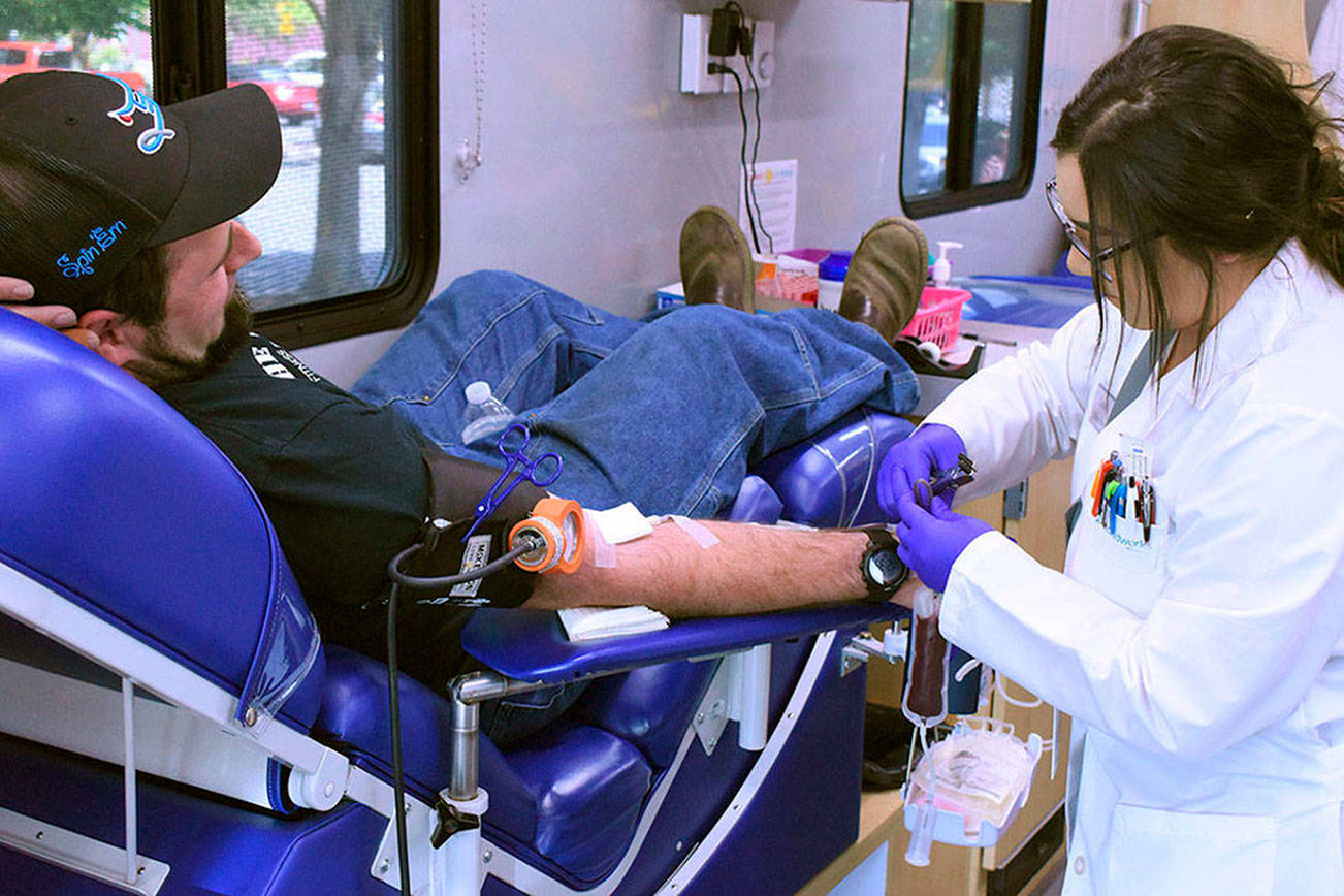 A mobile center from Bloodworks Northwest takes blood from Enumclaw resident Andy Bremmeyer, pictured in this 2019 photo. Sound Publishing file photo: https://www.redmond-reporter.com/news/bloodworks-northwest-reports-drop-in-blood-donations-following-coronavirus-outbreak/