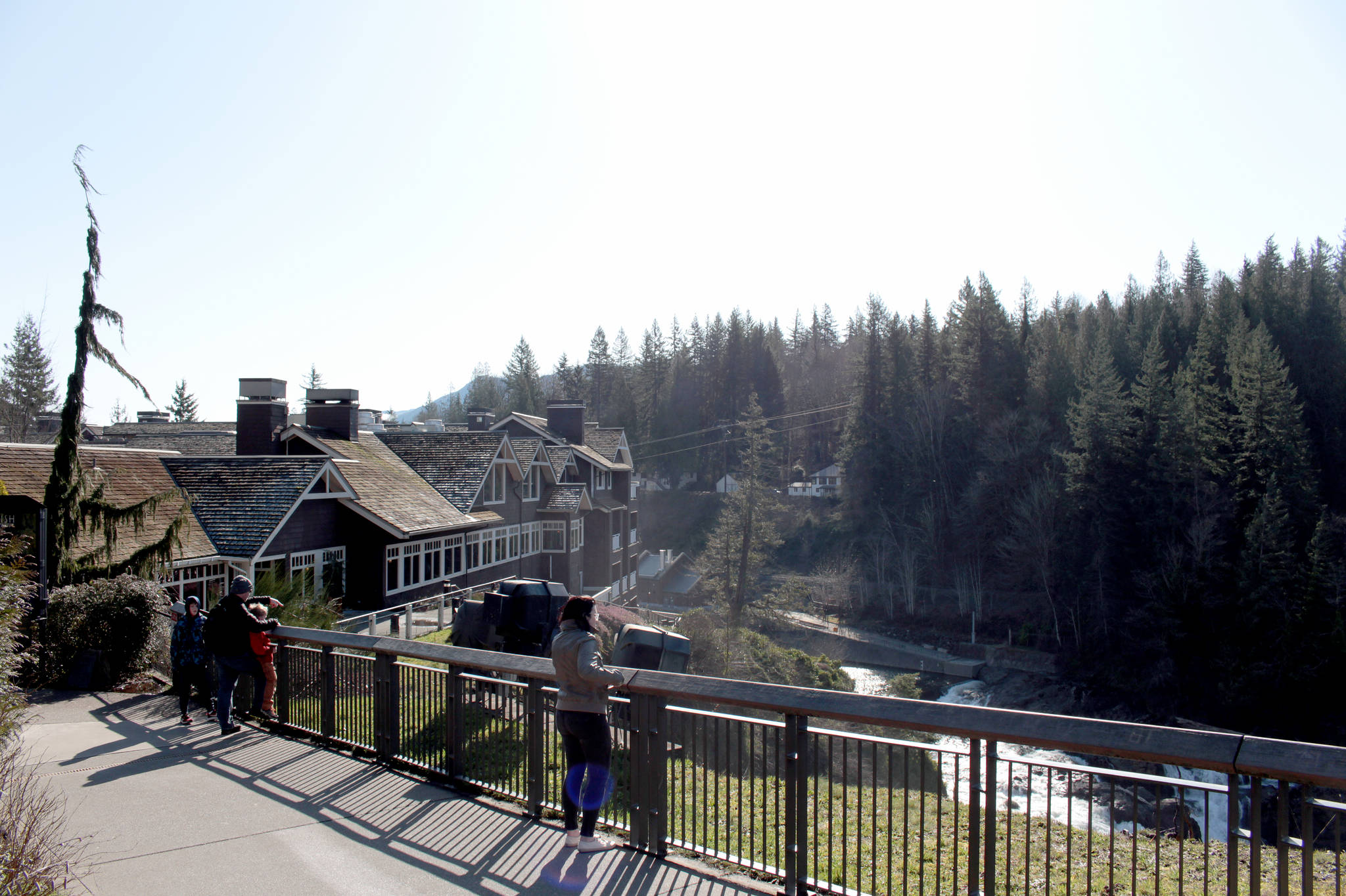 Sightseers at a Snoqualmie Falls viewpoint adjacent to the Salish Lodge & Spa on Feb. 19, 2020. Natalie DeFord/staff photo