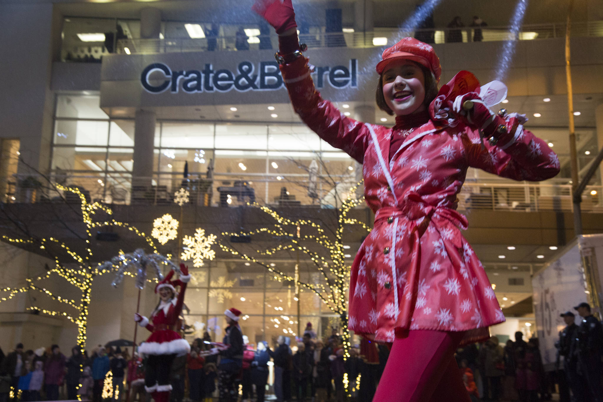 The sidewalks between Bellevue Square and Lincoln Square were packed with people who came to catch the nightly Snowflake Lane on Dec. 10. The parade, which begins nightly at 7 p.m., celebrates 15 years in the community and features 300 performers, holiday characters and lights. Ashley Hiruko/staff photo