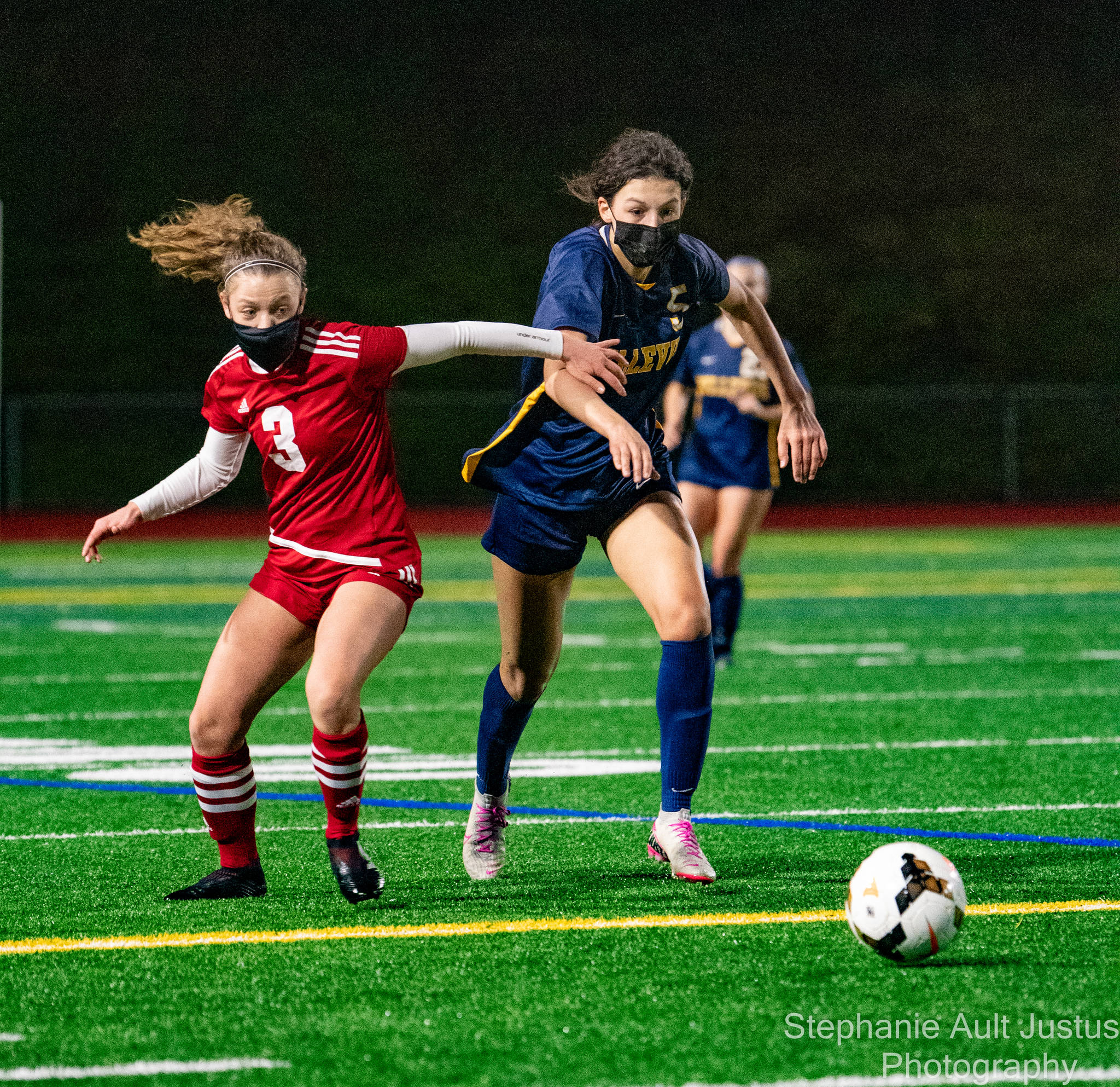 Newport’s Carmen Young (left) battles Bellevue’s Rebekah Roth for the ball during a girls soccer match on March 9 at Bellevue High. Roth scored the game’s lone goal with 11 minutes remaining in the match to give Bellevue a 1-0 victory. Photo courtesy of Stephanie Ault Justus