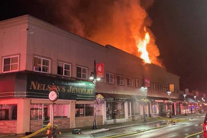 Fire inflicted heavy damage to the second floor and roof of the 2-story apartment-and ground-floor retail building at 115 East Main Street beginning late on the night of Friday July 23 and continuing into early Saturday morning. The Valley Regional Fire Authority reports that all residents got out safely. Photo courtesy Auburn Police Department.