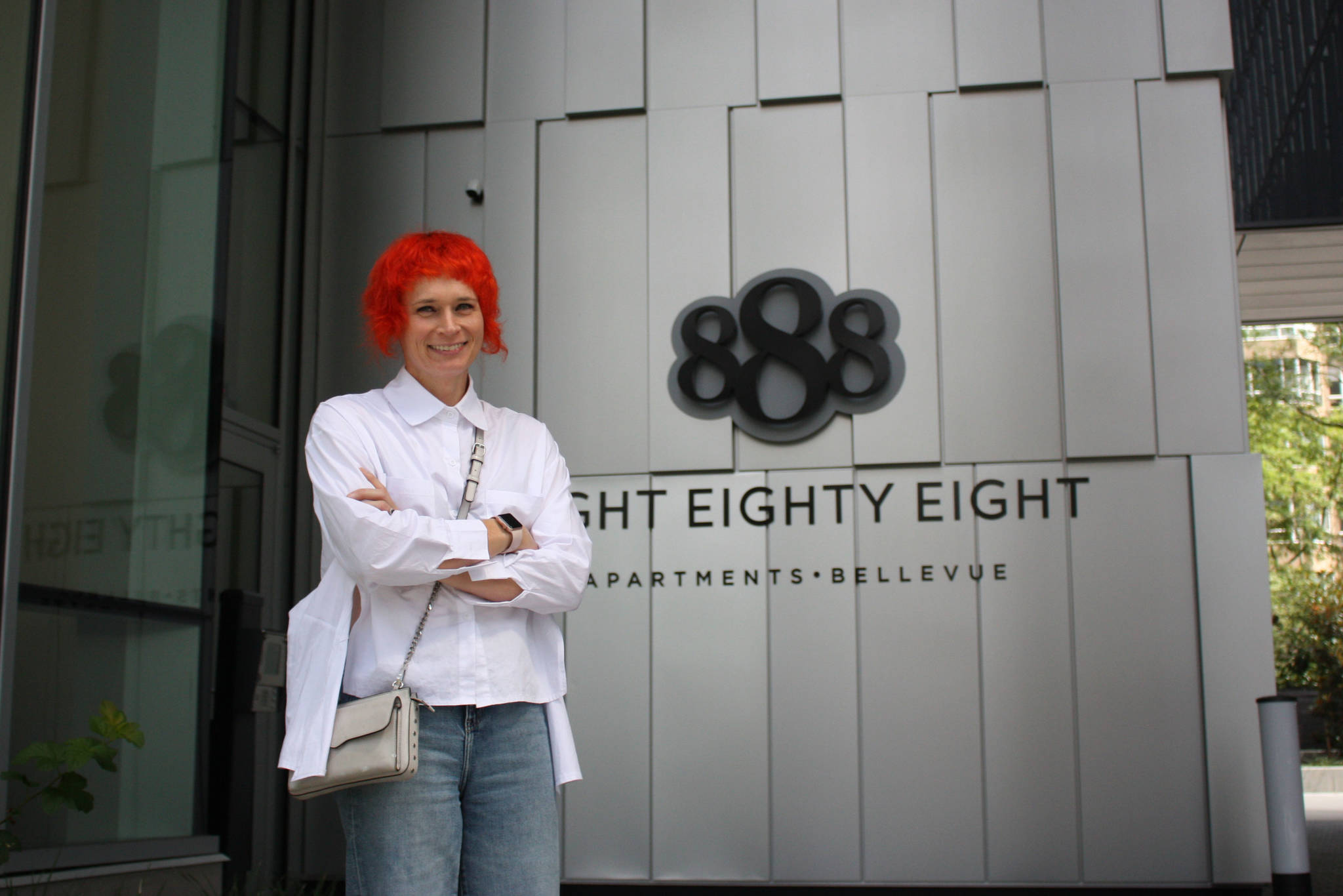 HEWITT architectural Director of Design, Julia Nagele stands in front of Bellevue’s 888 building (photo credit: Cameron Sheppard)