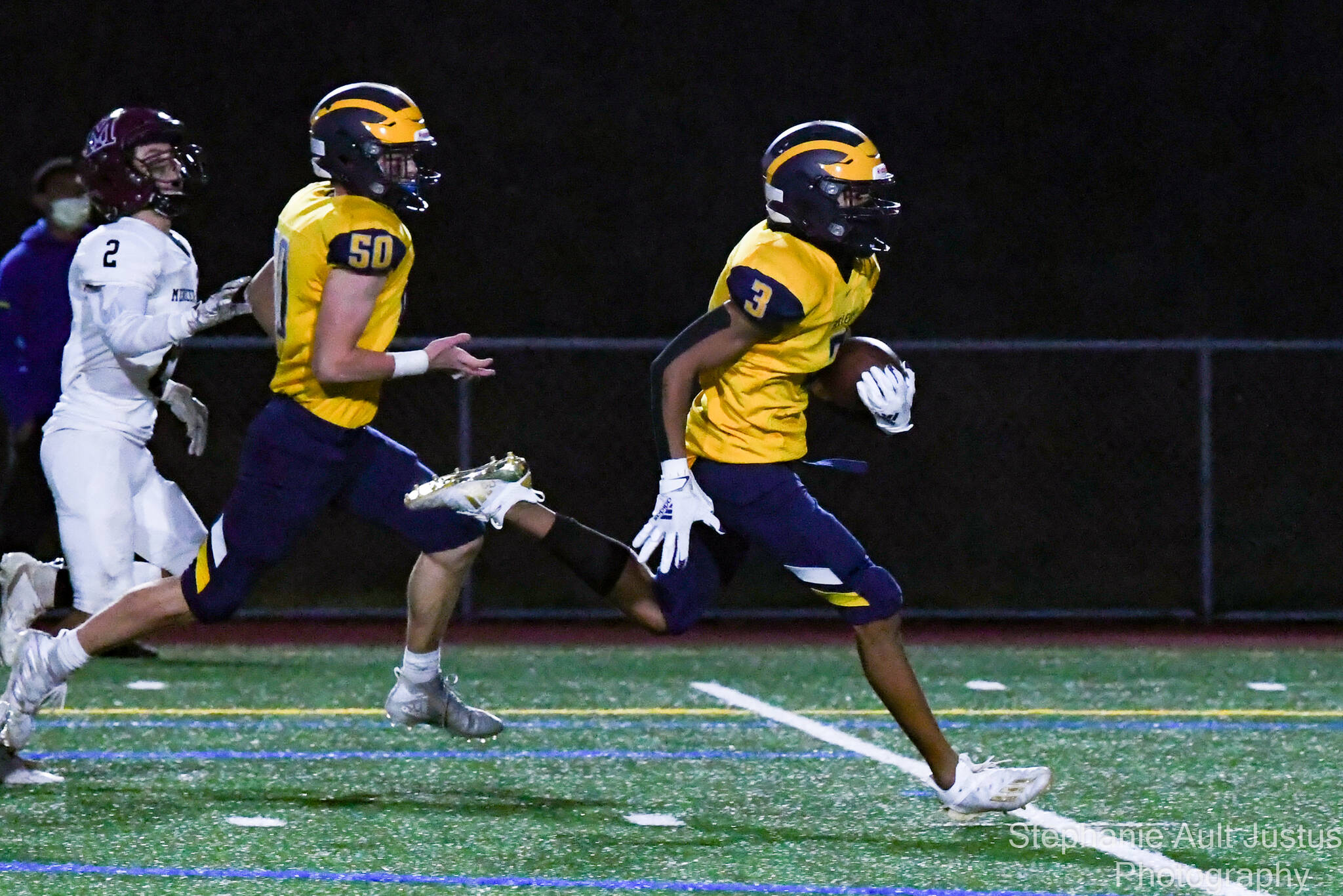 Bellevue’s Ishaan Daniels scores one of his touchdowns while Bellevue’s Leland Ryals and Mercer Island’s Nicholas Chatalas follow. Photo courtesy of Stephanie Ault Justus