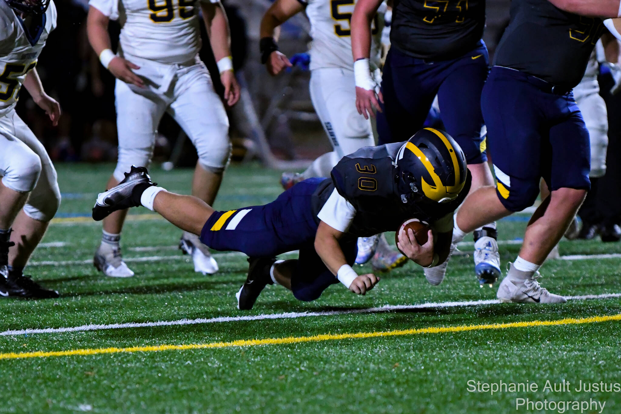 Bellevue’s William Wang dives for a touchdown during the Wolverines’ 42-0 3A district home victory over Southridge on Nov. 5. No. 1-seeded Bellevue (10-0) will next host Lakes in a state matchup at 7 p.m. on Nov. 12. Photo courtesy of Stephanie Ault Justus