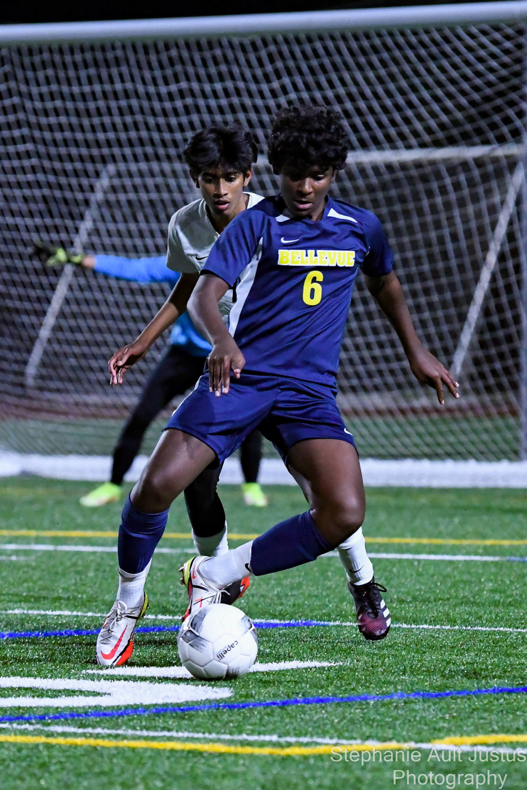 Sophomore Adhi Meyyappan (#6) dribbles the soccer ball past LWHS senior, Ryan Matta (#4). Courtesy of Stephanie Ault Justus.