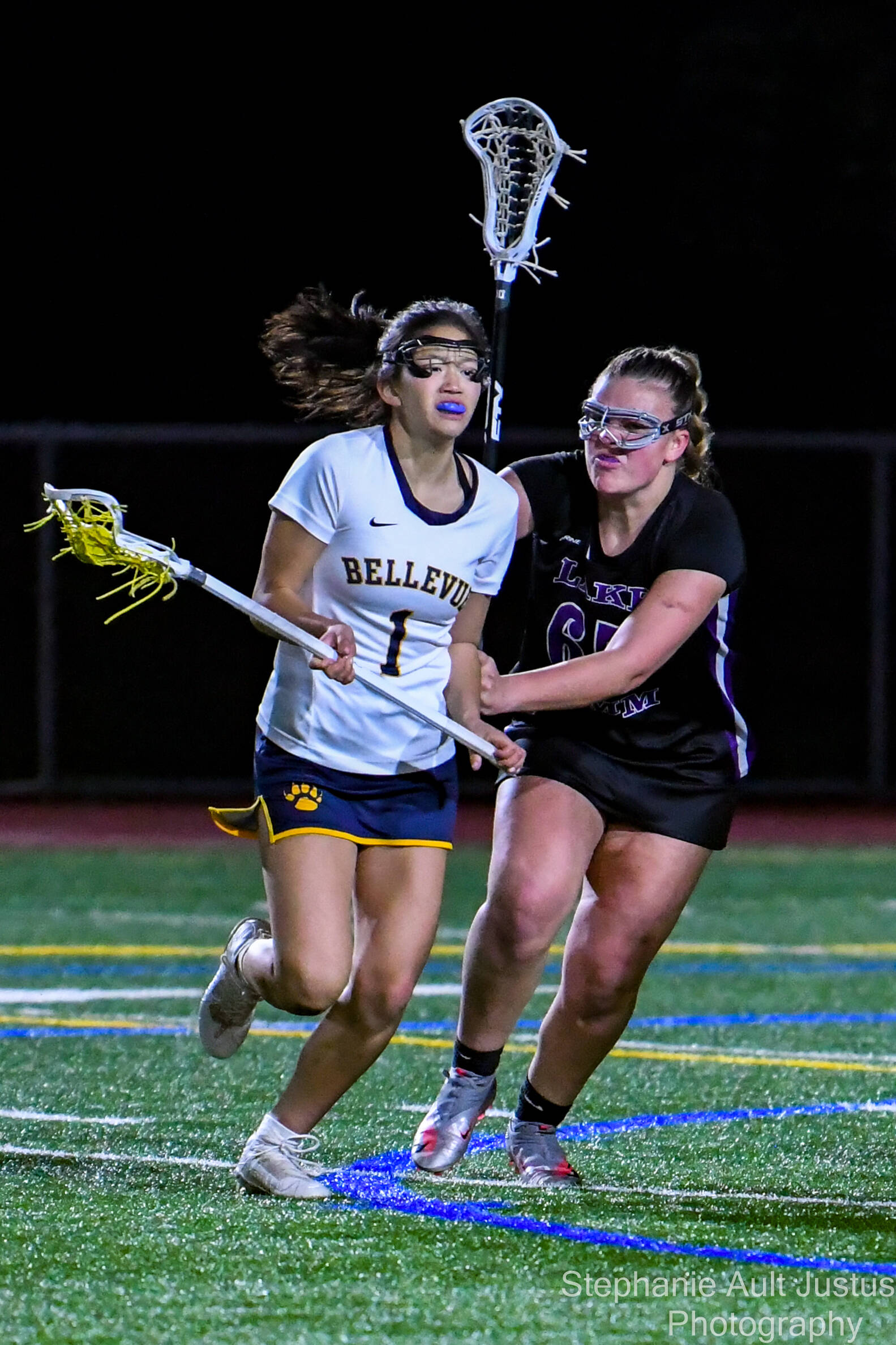 Bellevue player Lauren Park (#1) moves past Lake Sammamish player, Brooke Mead (#65). Courtesy of Stephanie Ault Justus.