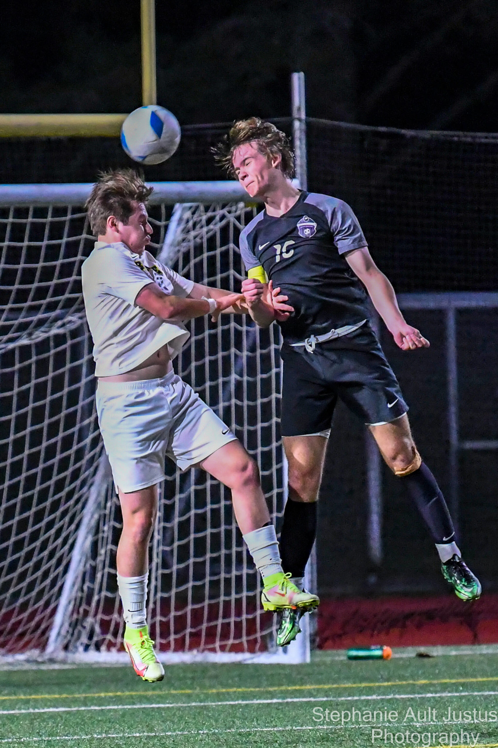 Junior Liam O’Cain (#16) goes face to face with Bellevue senior, Alex Mendoza (#9). Courtesy of Stephanie Ault Justus.